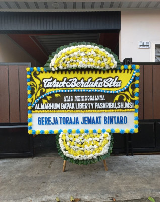 Papan Bunga Duka di Mancani